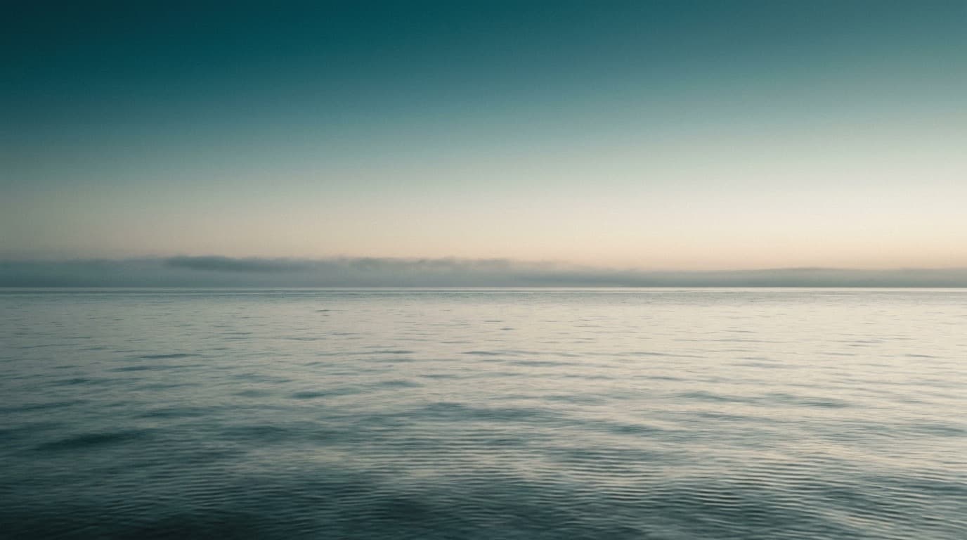 A quiet sea at dawn. Image created with AI.